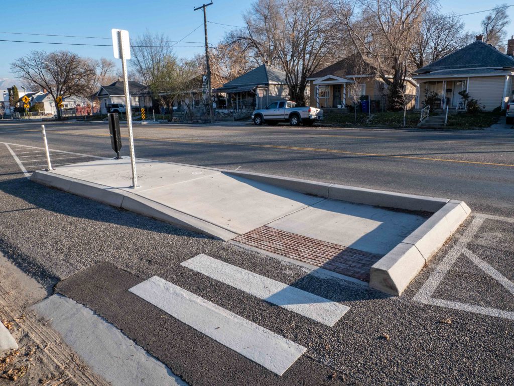 A photo of a bus boarding island on 400 South.