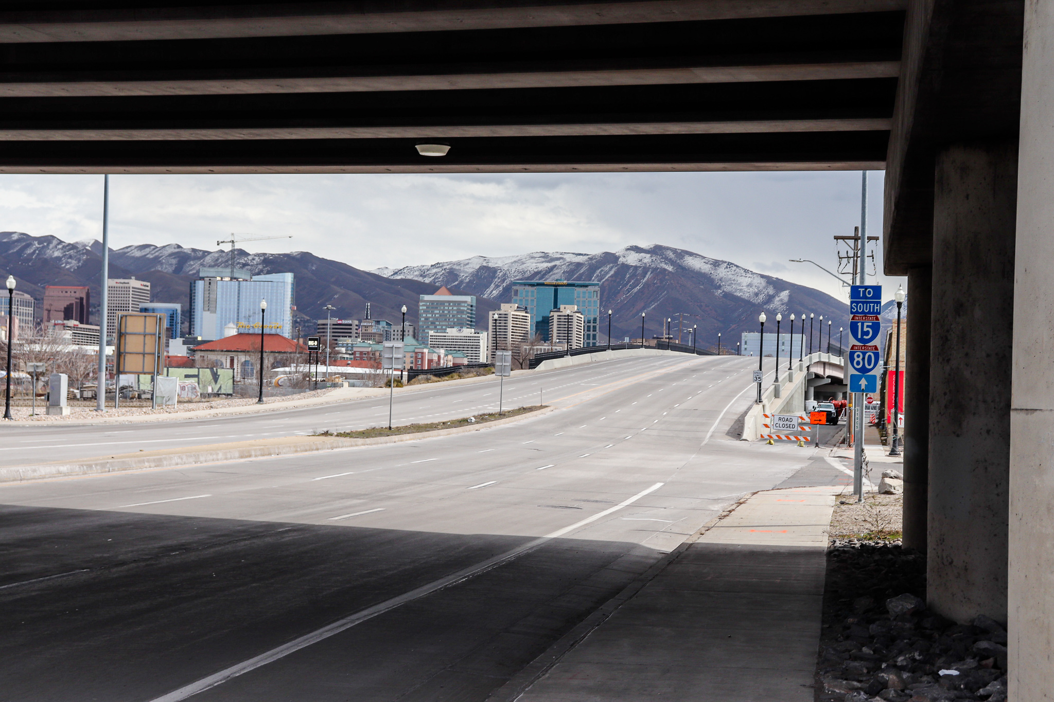 An image of the 400 South Viaduct bridge with the Salt Lake City skyline and foothills in the background.