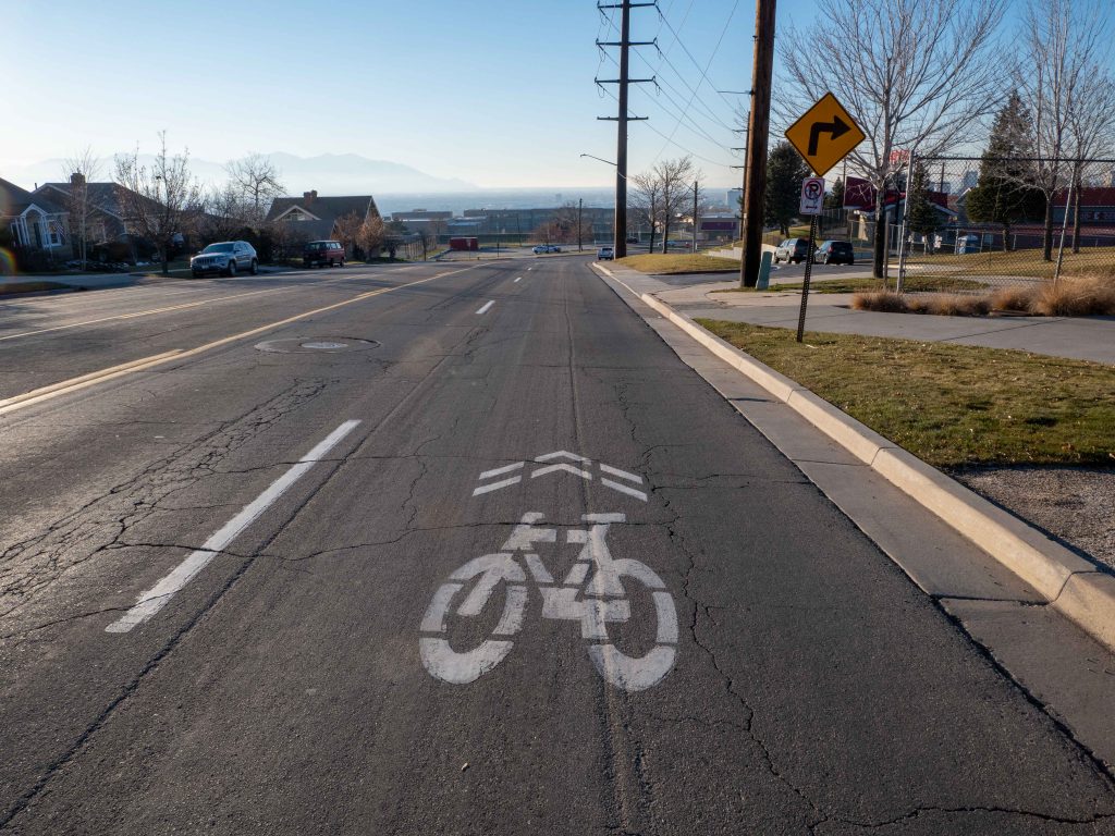A shared line marking on Sunnyside Avenue to guide cyclists and notify drivers of people biking in the street.