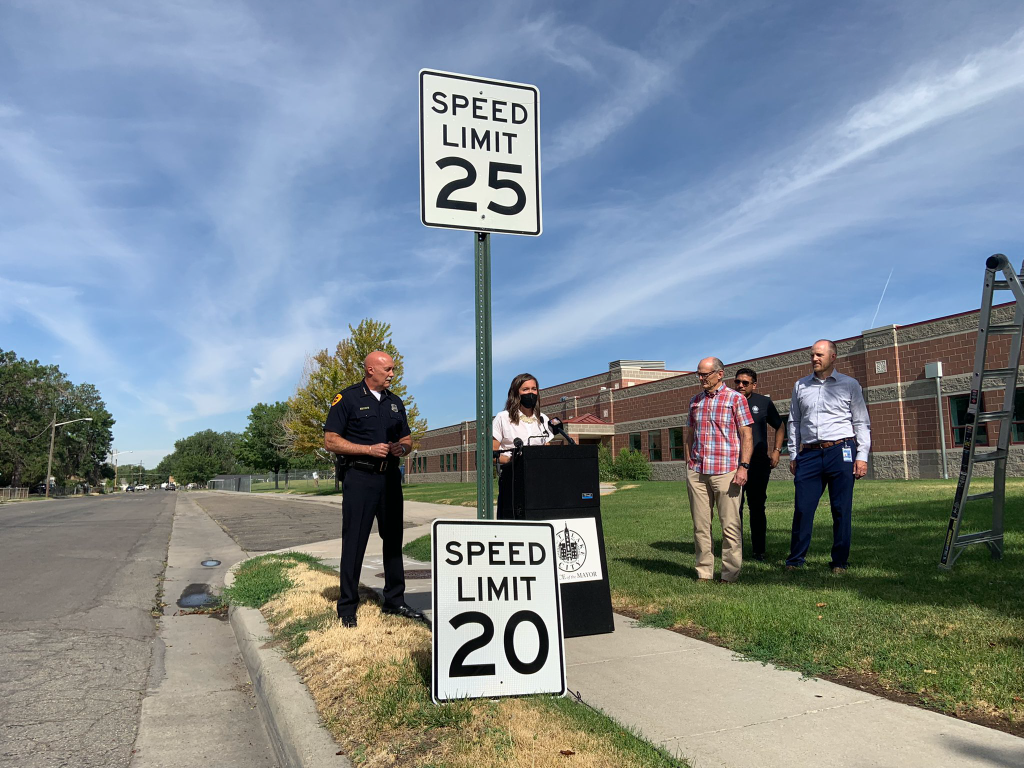 A picture of Mayor Mendenhall speaking about the 20 MPH local speed limit change. 